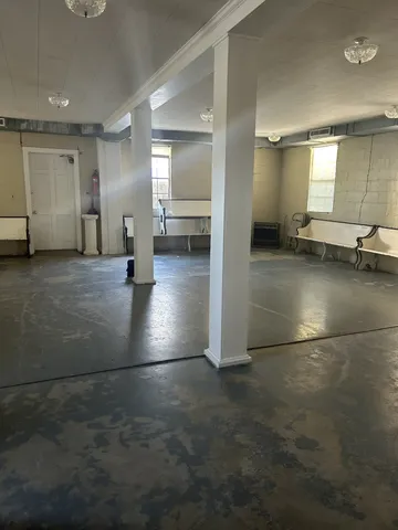 a kitchen with a table chairs and a sink