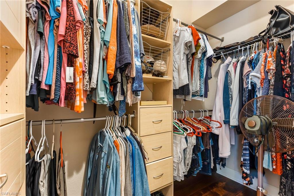 317 Steerforth Court Naples, FL 34110 - Photo 16 of 31 a view of walk in closet with clothes and shoes