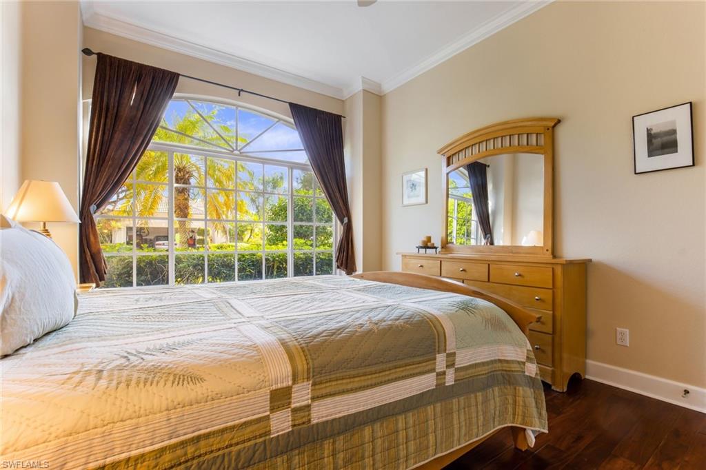 317 Steerforth Court Naples, FL 34110 - Photo 20 of 31 a bedroom with a bed and a large window
