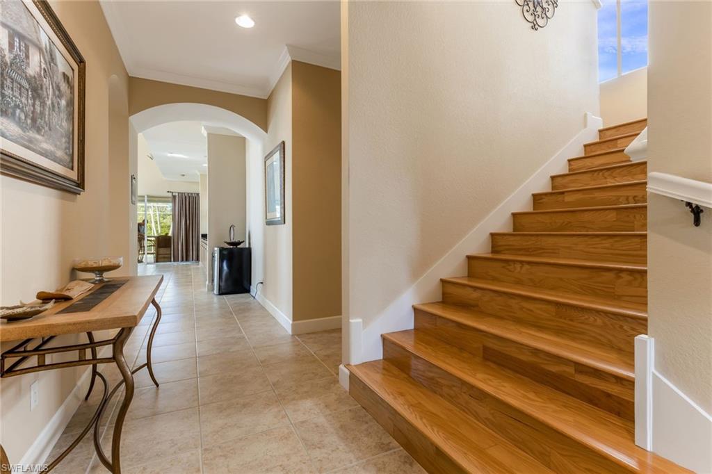 317 Steerforth Court Naples, FL 34110 - Photo 22 of 31 a view of entryway and hall with wooden floor