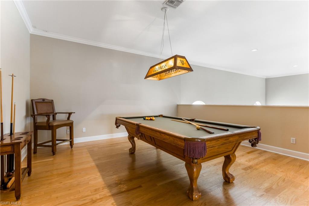 317 Steerforth Court Naples, FL 34110 - Photo 23 of 31 a room with furniture and air hockey table