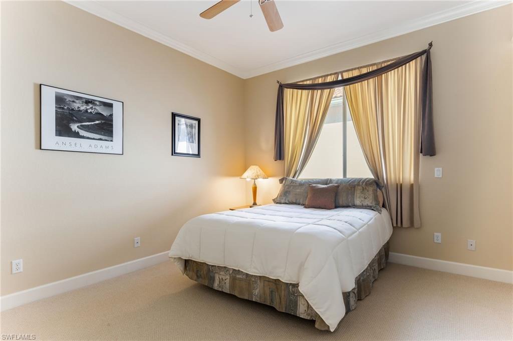 317 Steerforth Court Naples, FL 34110 - Photo 24 of 31 a bedroom with a bed and a window
