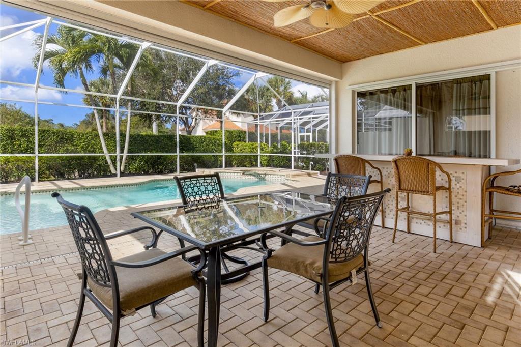 317 Steerforth Court Naples, FL 34110 - Photo 29 of 31 a patio with table and chairs