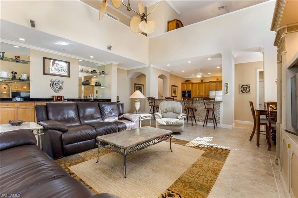 317 Steerforth Court Naples, FL 34110 - Photo 6 of 31 a living room with lots of furniture and view of kitchen