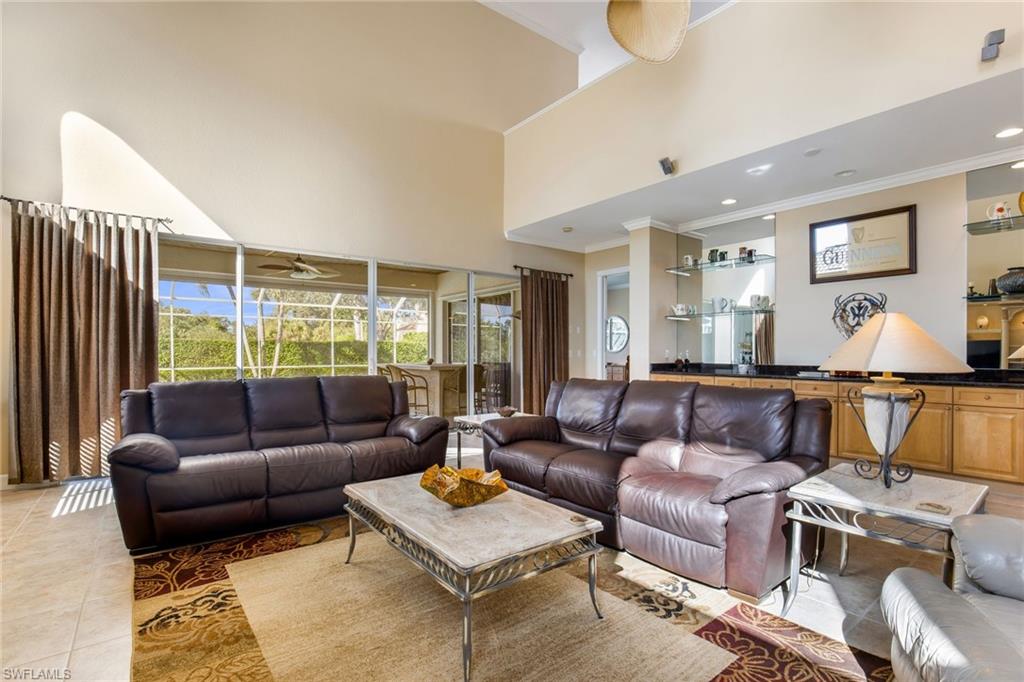 317 Steerforth Court Naples, FL 34110 - Photo 8 of 31 a living room with furniture and a window