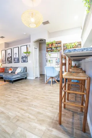 a kitchen with stainless steel appliances granite countertop a sink a stove and a refrigerator