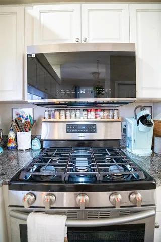 a view of a living room and kitchen