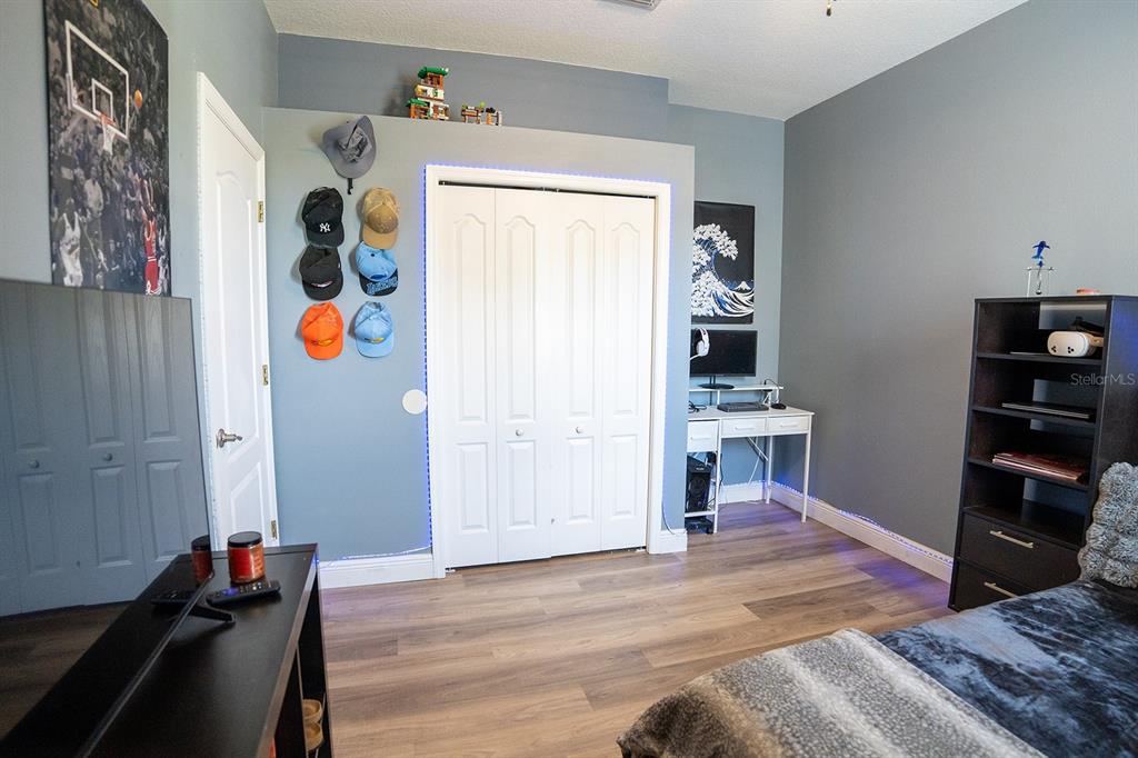 6207 Kiteridge Drive Lithia, FL 33547 - Photo 15 of 25 a bedroom with a bed and furniture