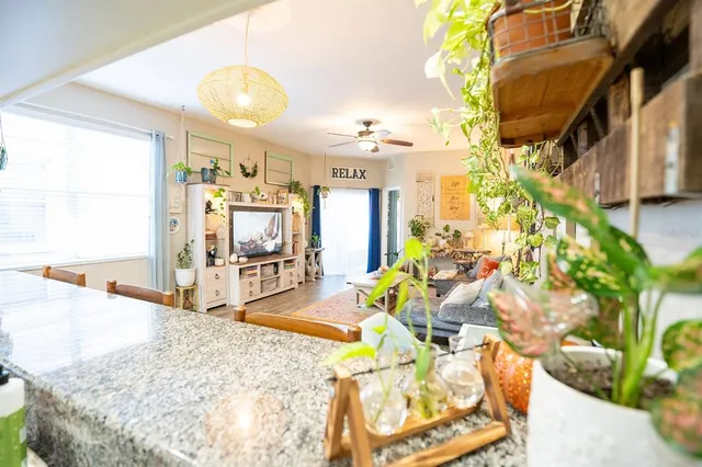 a bedroom with a bed and ceiling fan