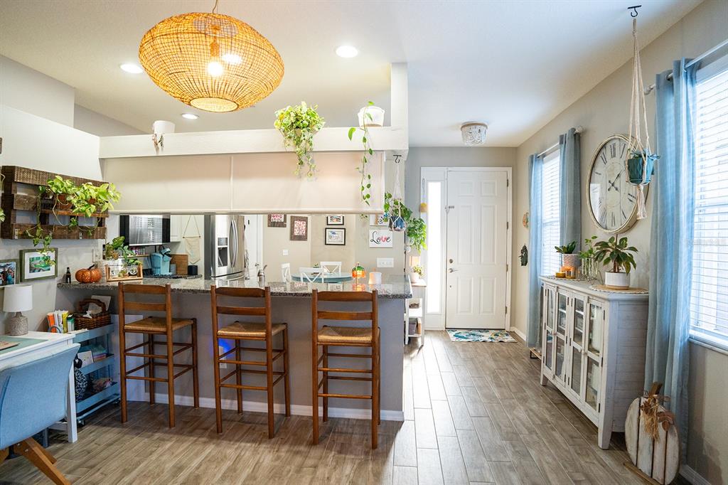 6207 Kiteridge Drive Lithia, FL 33547 - Photo 19 of 39 a view of a a dining room with furniture window and wooden floor