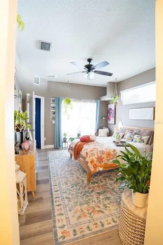 a bedroom with a bed and furniture