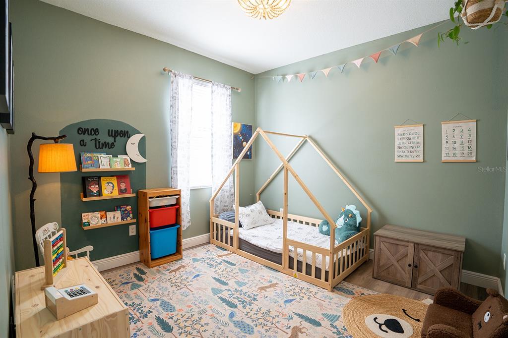 6207 Kiteridge Drive Lithia, FL 33547 - Photo 27 of 39 a living room with furniture and a wooden floor