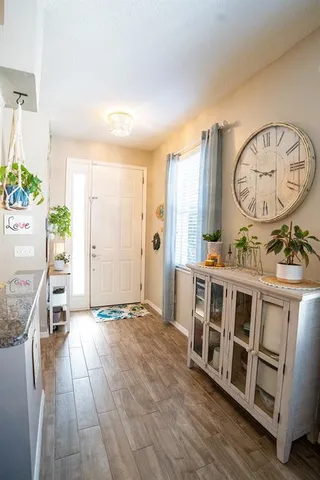 a living room with window and a table