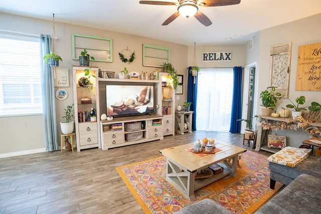 a living room with furniture and a flat screen tv