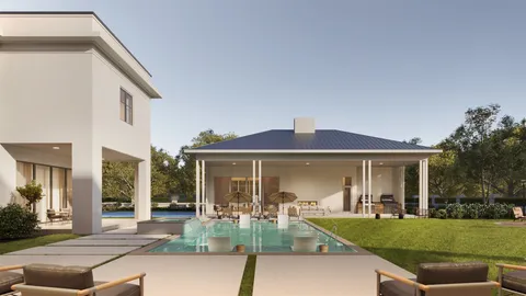 a front view of a house with a garden and patio