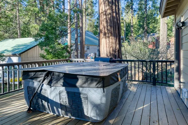 a view of balcony with wooden floor and outdoor seating