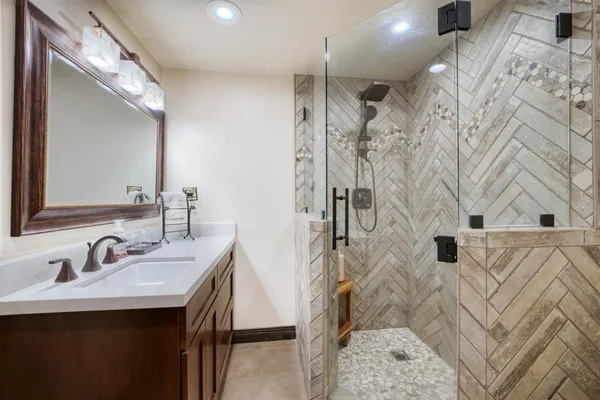 a bathroom with a sink and mirror