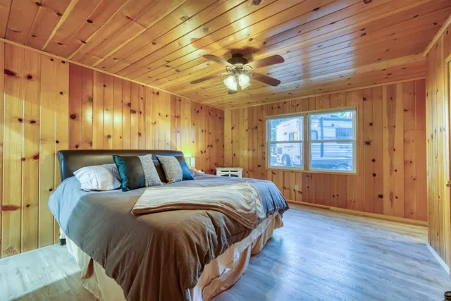 a bed room with a bed and a dresser