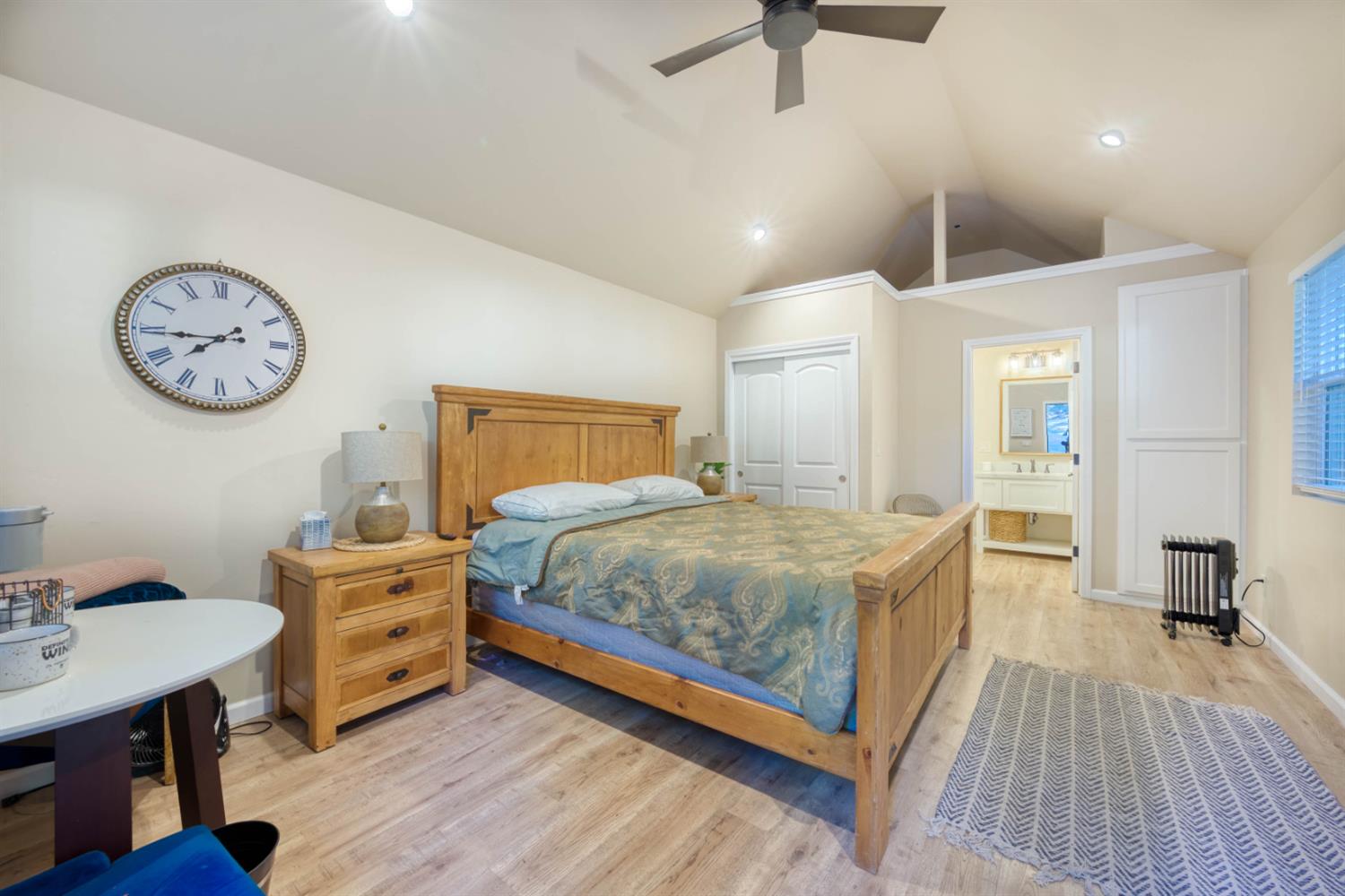 41958 North Aspen Road Shaver Lake, CA 93664 - Photo 37 of 45 a spacious bedroom with a bed and a table in it