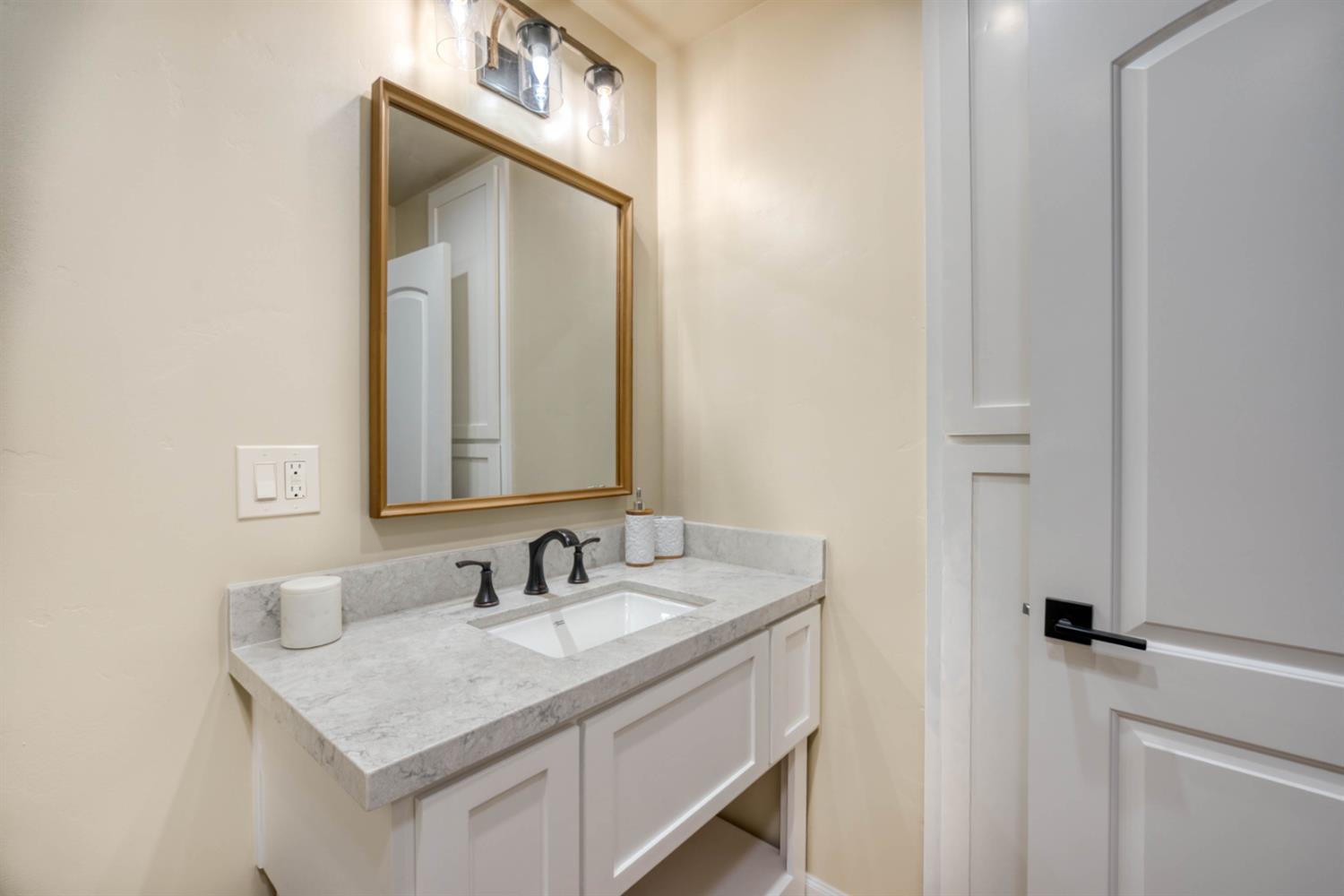 41958 North Aspen Road Shaver Lake, CA 93664 - Photo 39 of 45 a bathroom with a granite countertop sink and a mirror