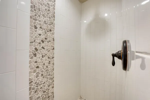 a view of a hall with dining table and chairs