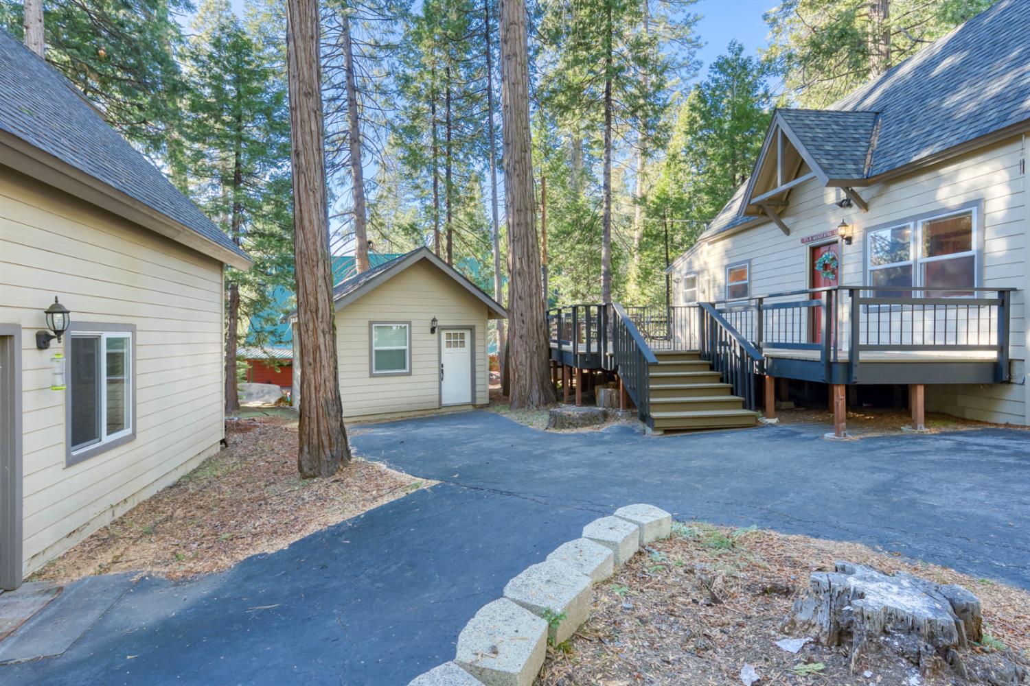 41958 North Aspen Road Shaver Lake, CA 93664 - Photo 5 of 45 a view of a house with a yard and deck