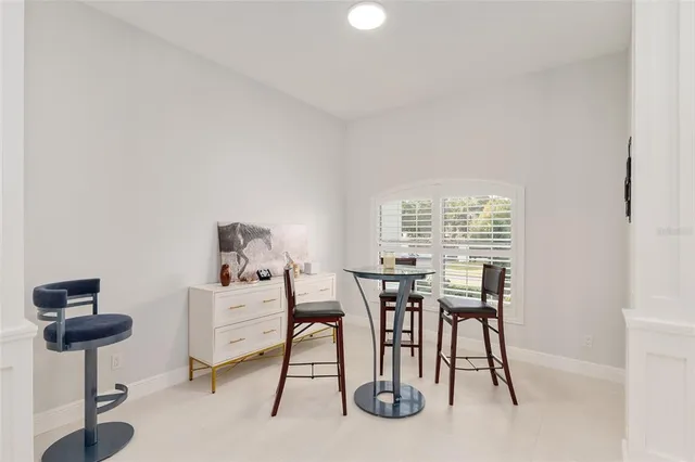 a large kitchen with stainless steel appliances granite countertop lots of counter top space and wooden floor