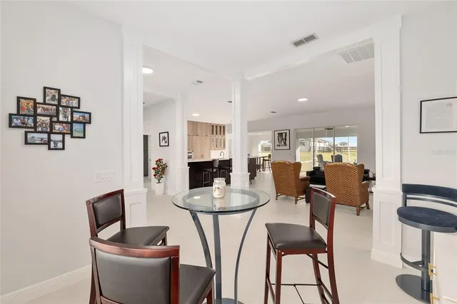 a bedroom with a bed and a white wall