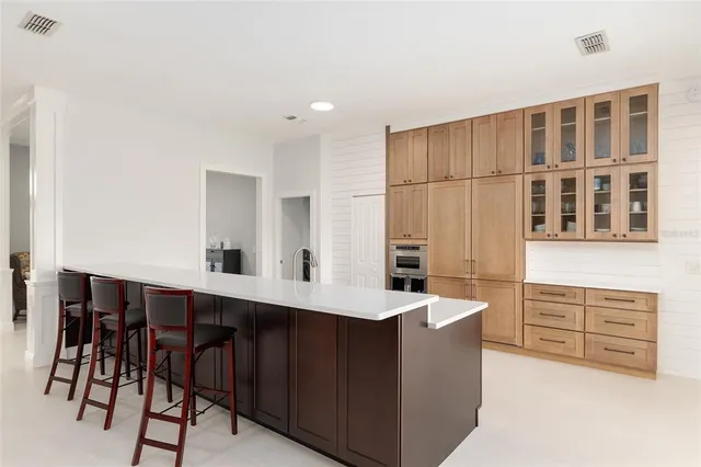 a bathroom with a sink mirror and a shower