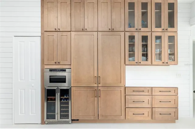 a utility room with sink dryer and washer