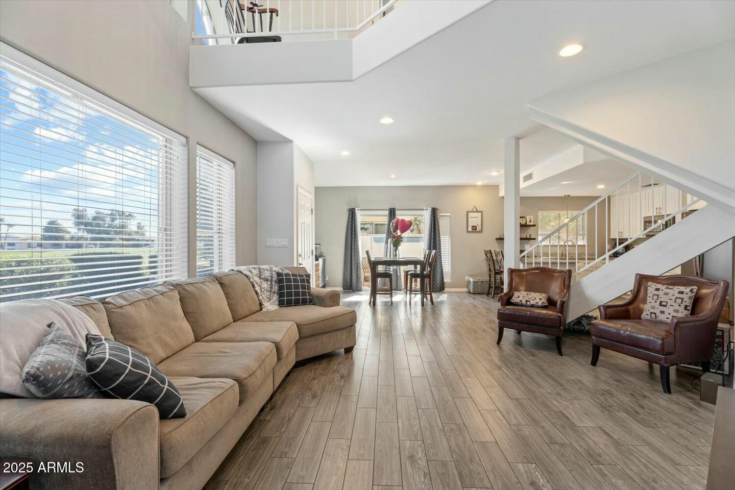 8813 South 51st Street, Unit 3 Phoenix, AZ 85044 - Photo 1 of 28 a living room with furniture and wooden floor