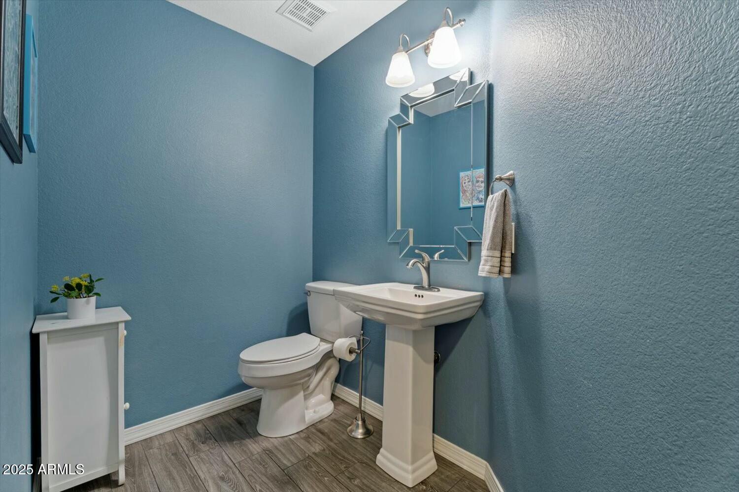 8813 South 51st Street, Unit 3 Phoenix, AZ 85044 - Photo 14 of 28 a bathroom with a sink toilet and a mirror