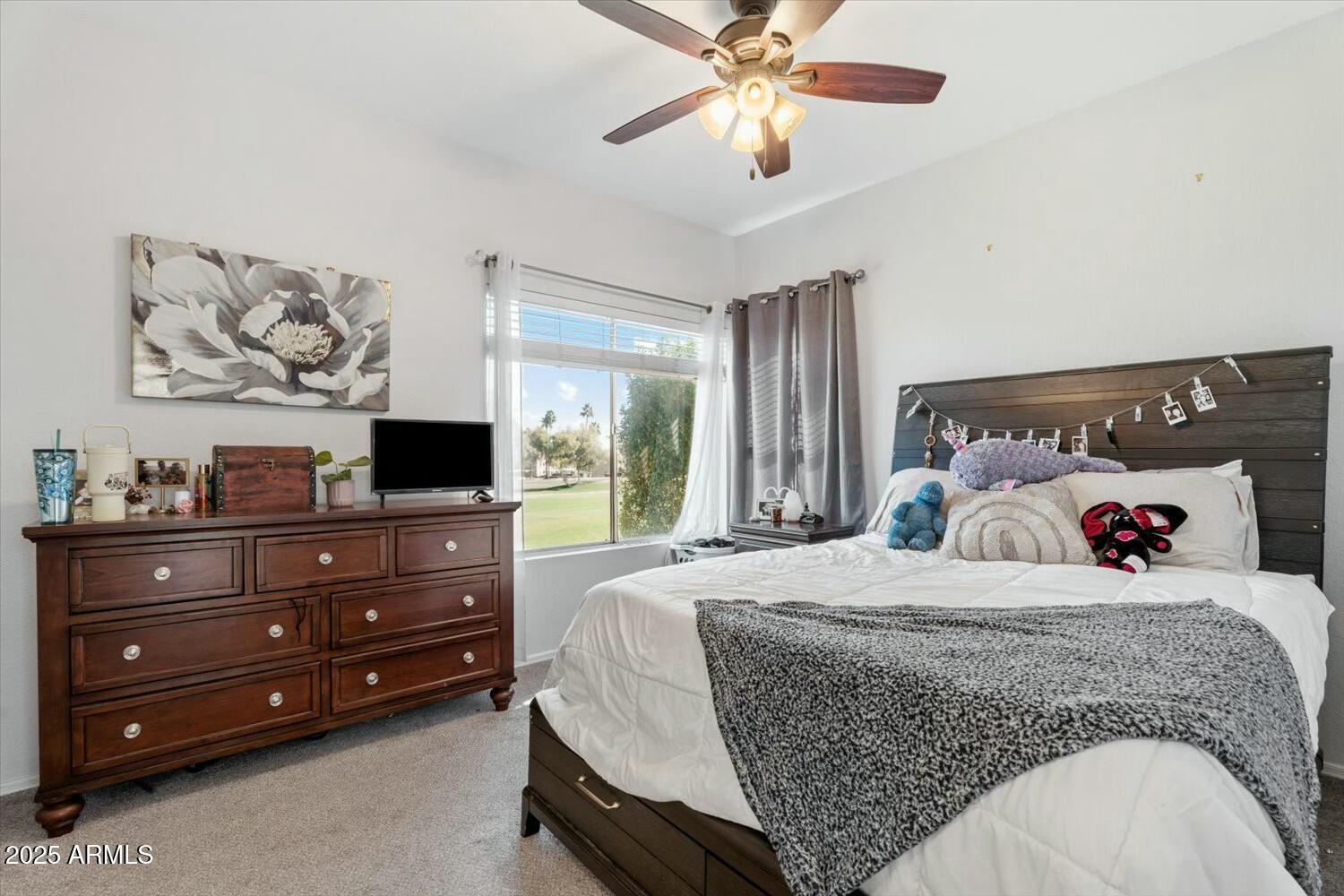 8813 South 51st Street, Unit 3 Phoenix, AZ 85044 - Photo 16 of 28 a bedroom with a bed and ceiling fan