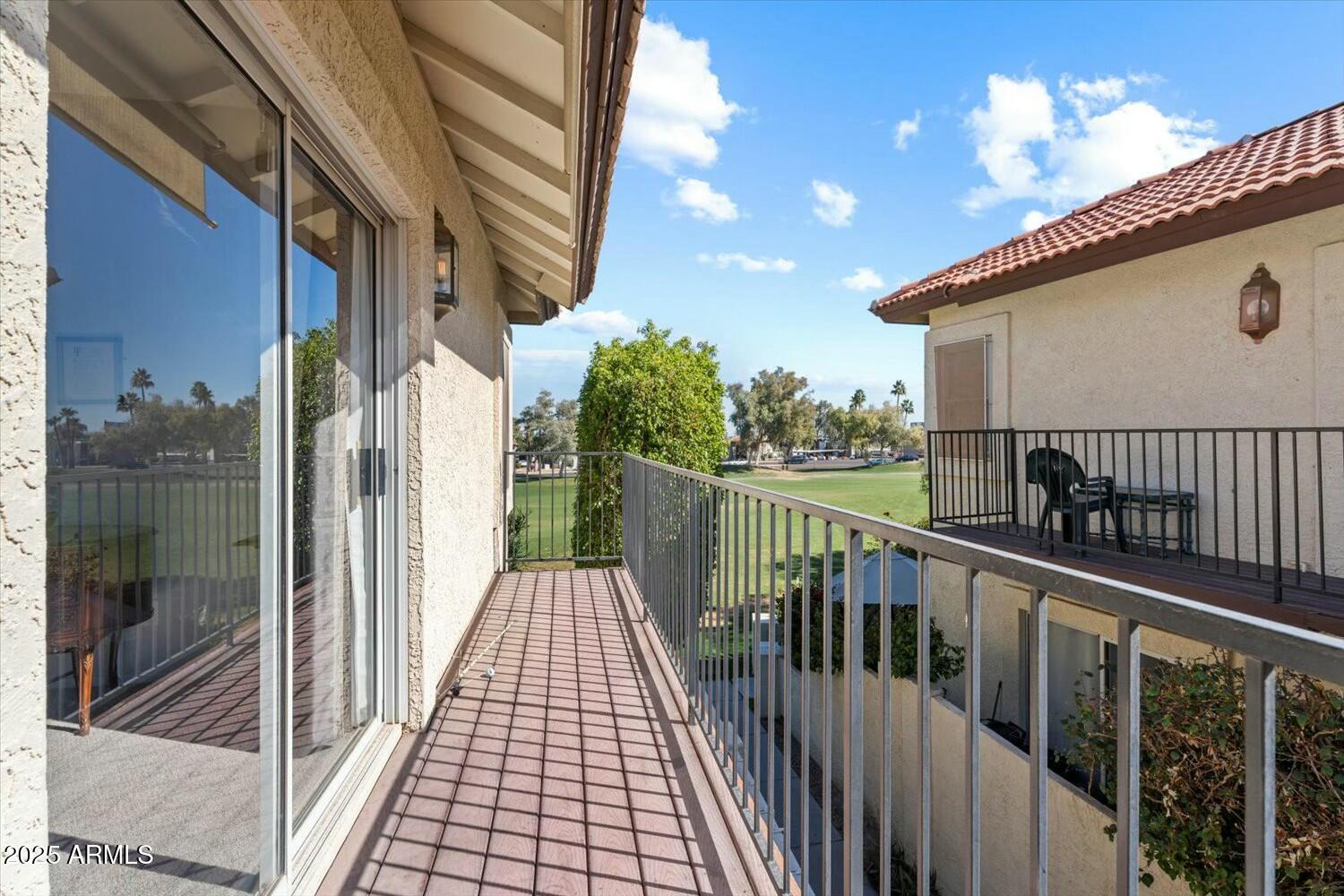 8813 South 51st Street, Unit 3 Phoenix, AZ 85044 - Photo 18 of 28 a view of a balcony with wooden floor