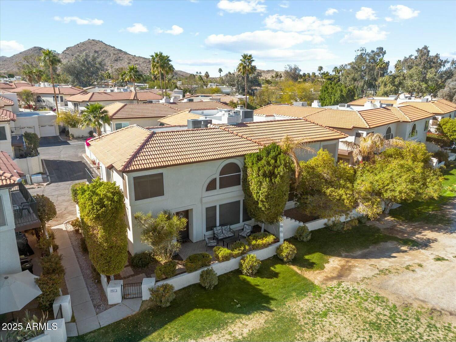8813 South 51st Street, Unit 3 Phoenix, AZ 85044 - Photo 22 of 28 a view of a house with a yard and sitting area