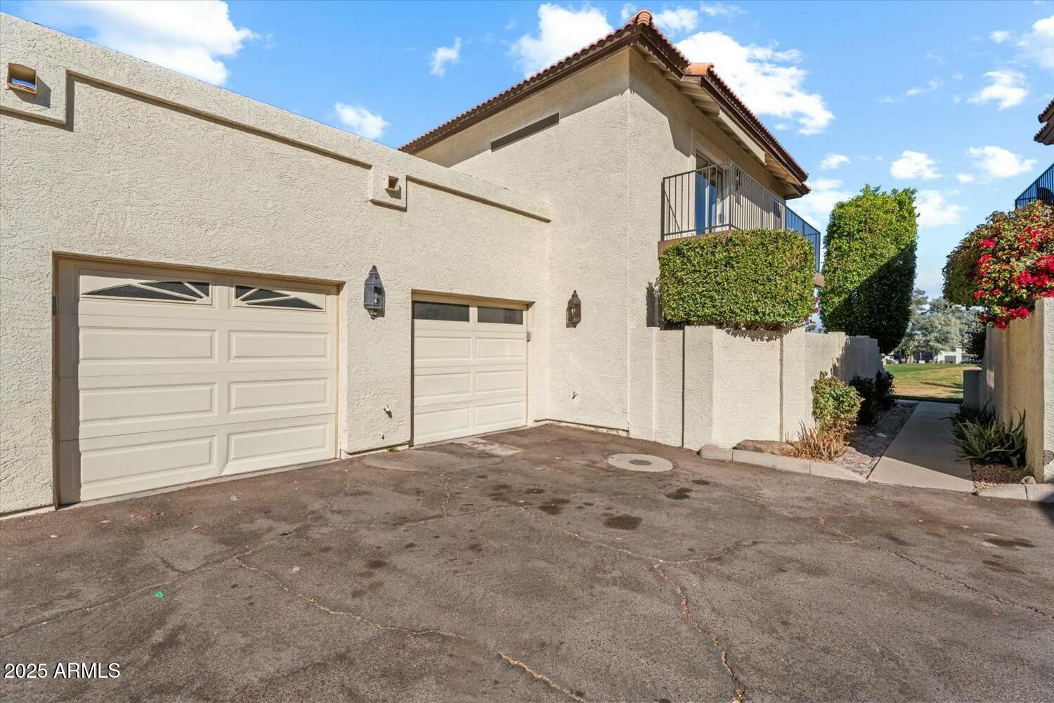 8813 South 51st Street, Unit 3 Phoenix, AZ 85044 - Photo 24 of 28 a view of a house with a garage