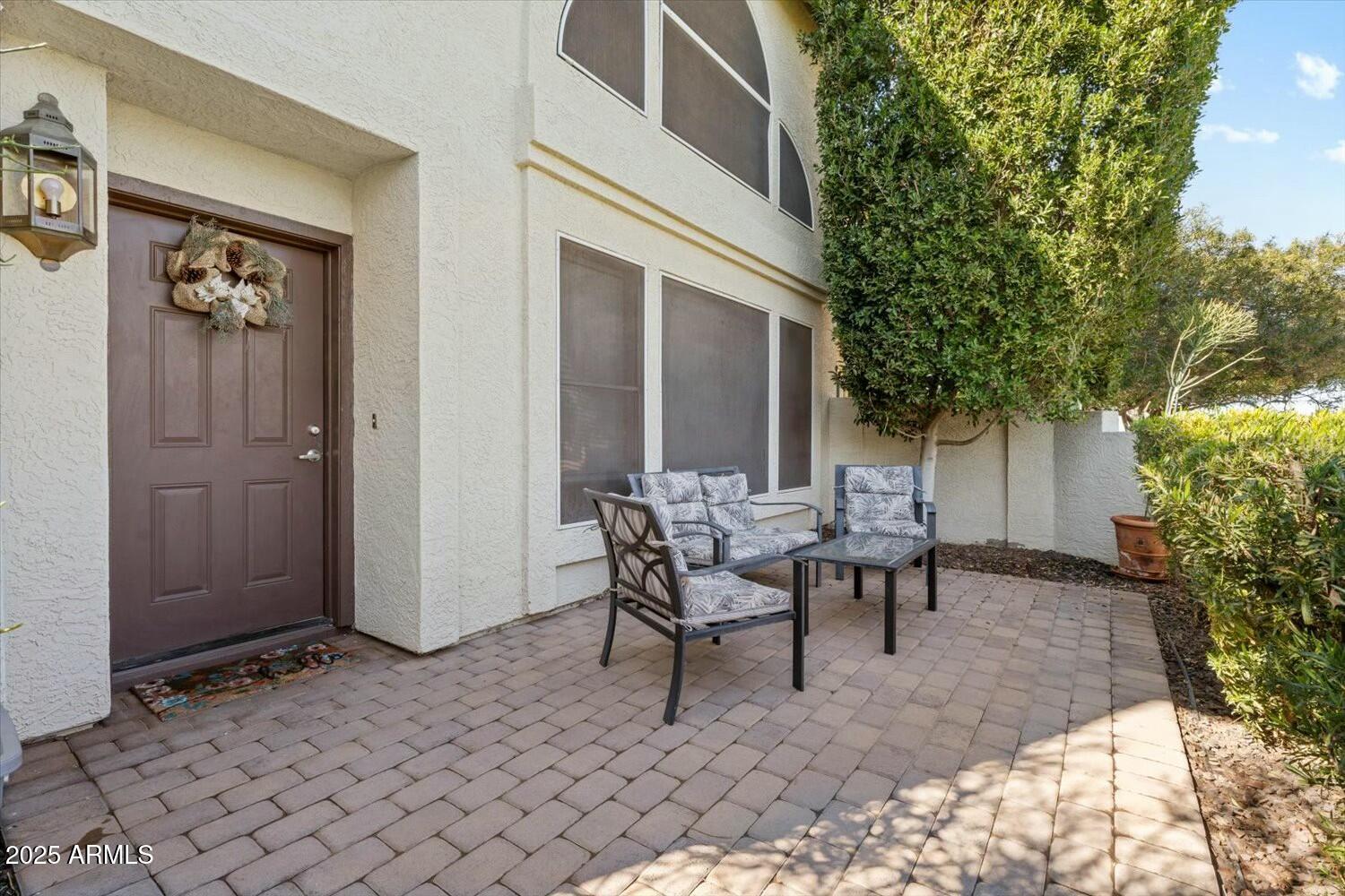 8813 South 51st Street, Unit 3 Phoenix, AZ 85044 - Photo 3 of 28 a view of a house with backyard and sitting area