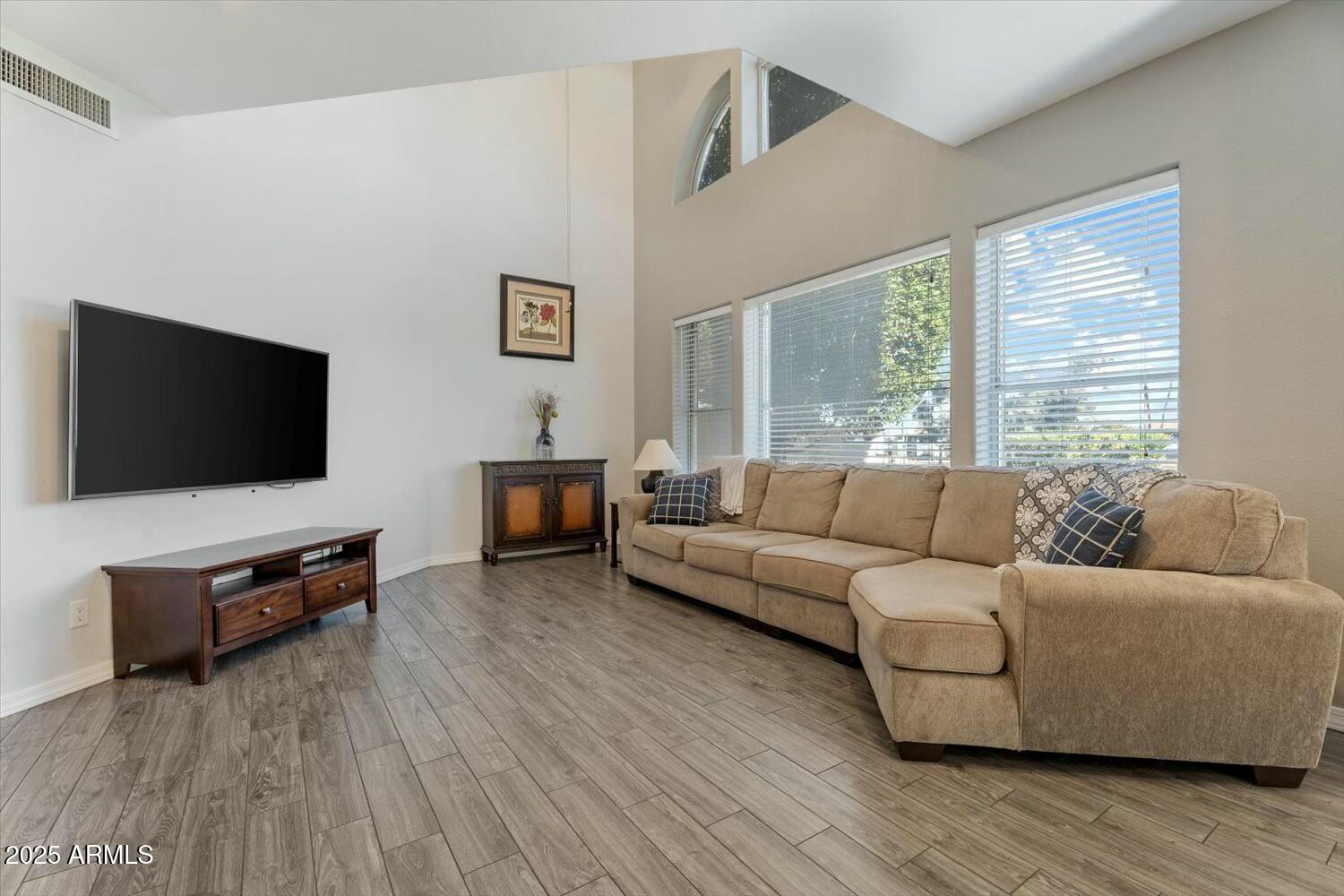 8813 South 51st Street, Unit 3 Phoenix, AZ 85044 - Photo 6 of 28 a living room with furniture and a flat screen tv
