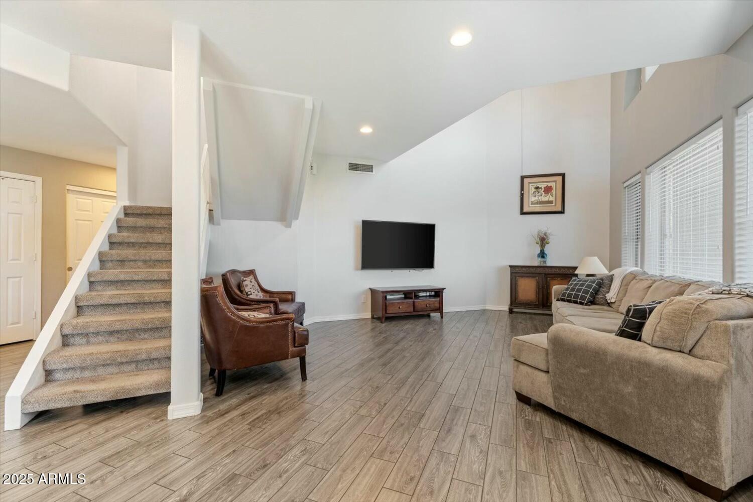 8813 South 51st Street, Unit 3 Phoenix, AZ 85044 - Photo 7 of 28 a living room with furniture and a wooden floor