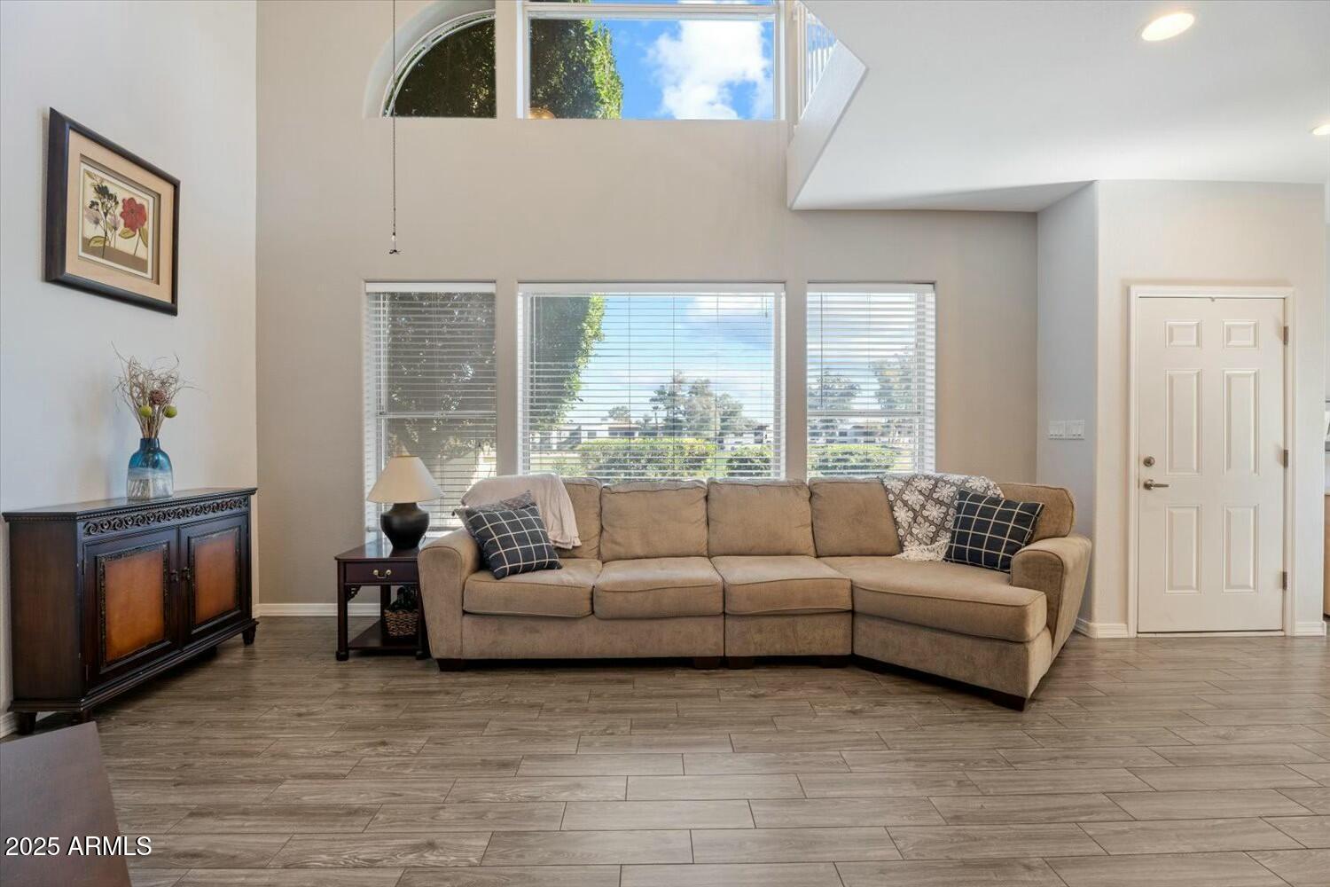 8813 South 51st Street, Unit 3 Phoenix, AZ 85044 - Photo 8 of 28 a living room with furniture and a large window