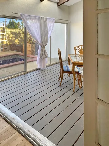 a room with wooden floor and furniture