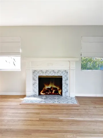 a living room with a fireplace and a fireplace