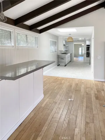 a view of kitchen with cabinets and wooden floor