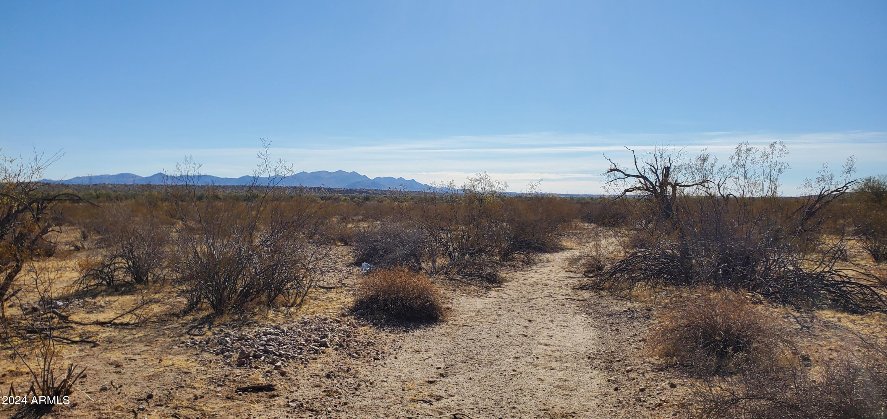 29150 West Radford Road, Unit 82 Wittmann, AZ 85361 - Photo 6 of 6 a view of a lake with a mountain in the background