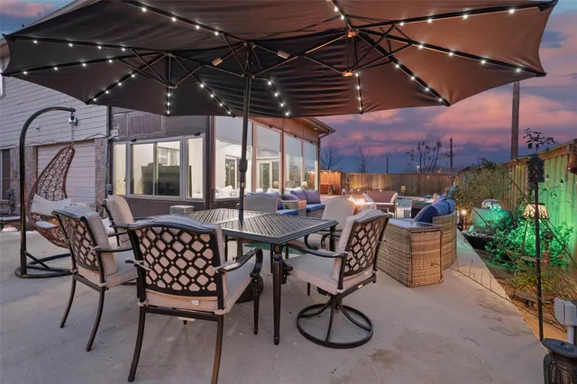 a patio with a table and chairs