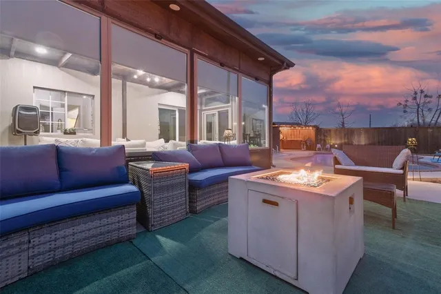 a living room with furniture and a city view