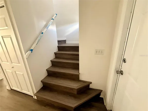 a view of entryway with wooden floor