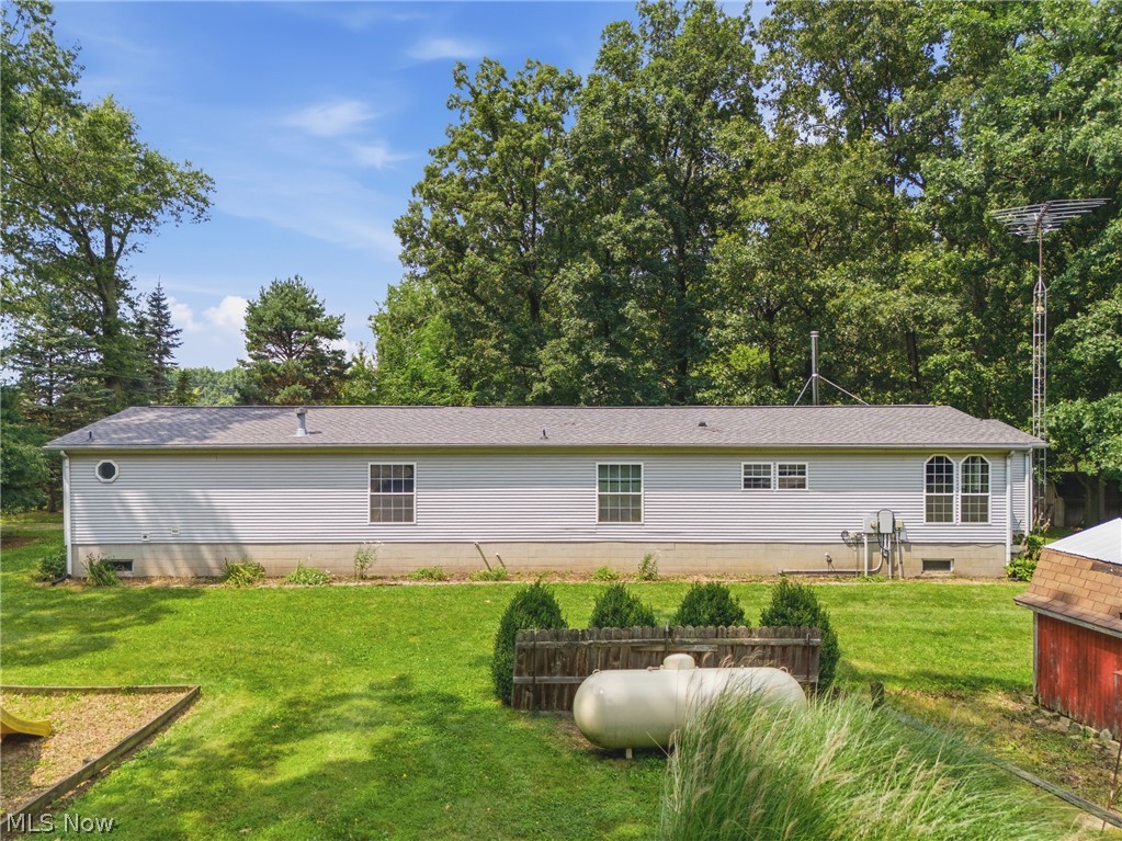 6828 Angling Road Wooster, OH 44691 - Photo 31 of 43 Spacious exterior featuring light gray siding and a gray shingle roof