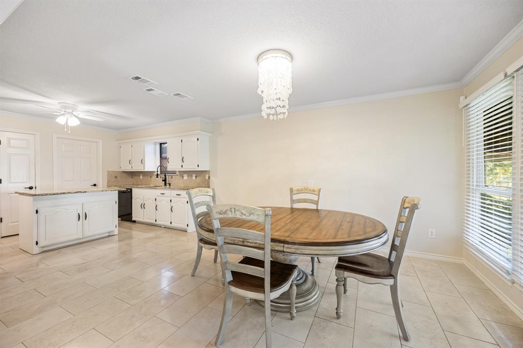 3002 Preston Court Rockwall, TX 75087 - Photo 11 of 39 a view of a dining room with furniture and a window