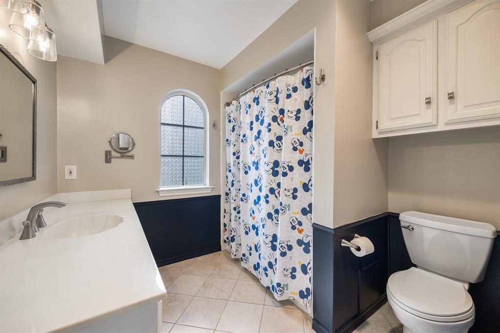 3002 Preston Court Rockwall, TX 75087 - Photo 24 of 39 a bathroom with a sink toilet and shower